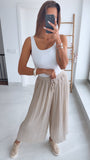Pantalones plisados